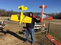 Crazy Eddie holding both planes he won with